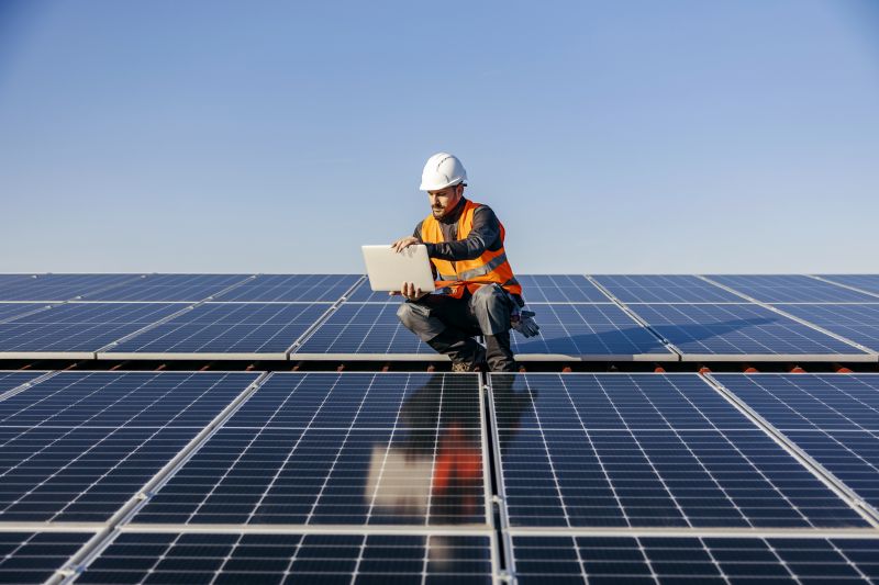 Maintenance Technician inspecting solar panels